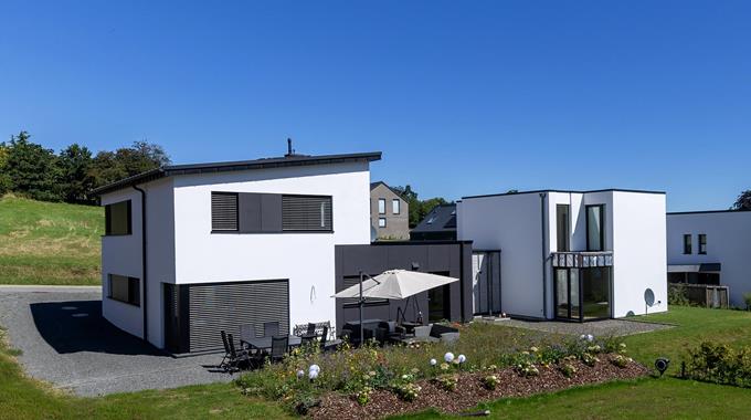 Construction d'une maison individuelle attenante à une maison existante