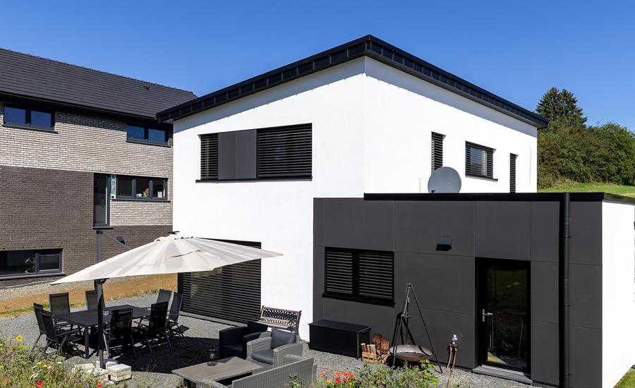 Construction d'une maison individuelle attenante à une maison existante