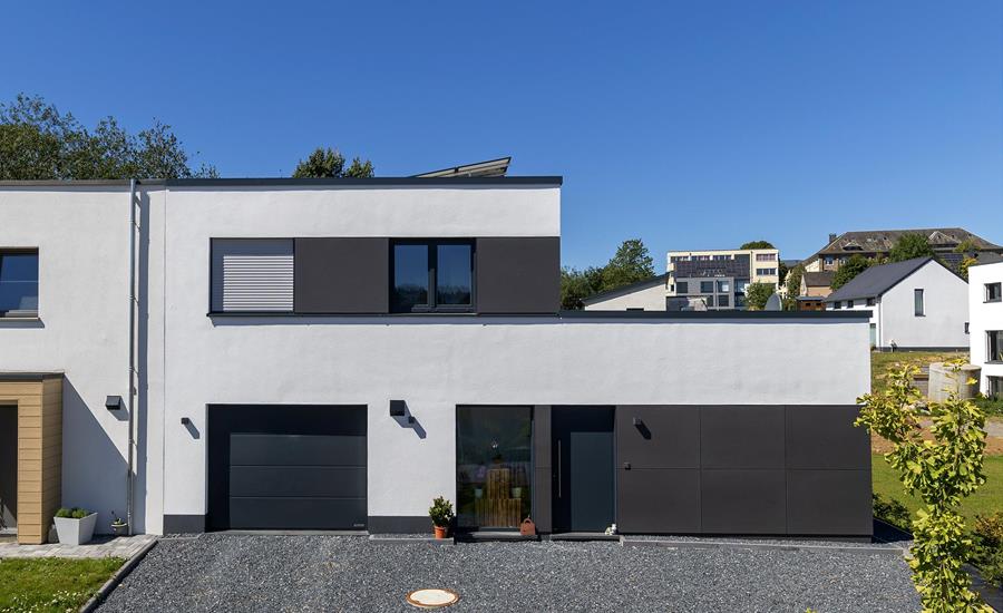 Construction d'une maison unifamiliale adjacente à une maison existante