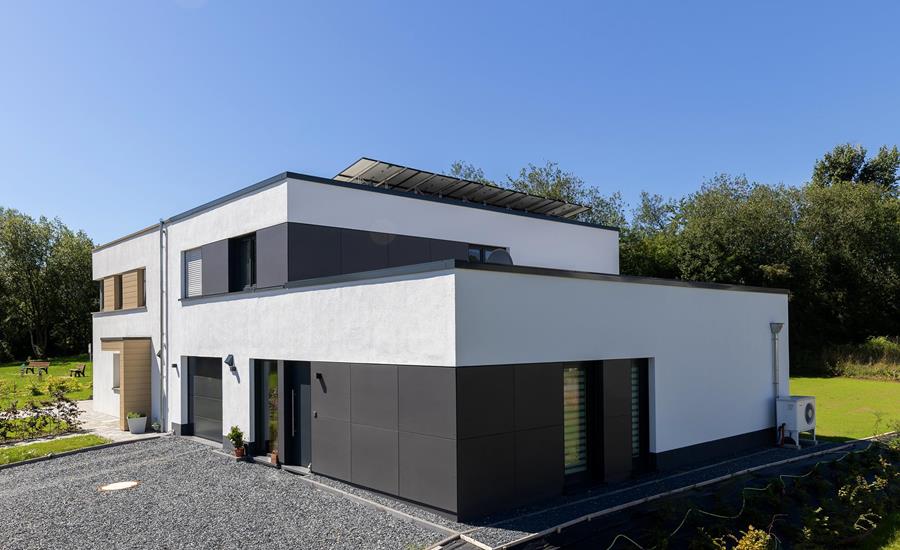 Construction d'une maison unifamiliale adjacente à une maison existante